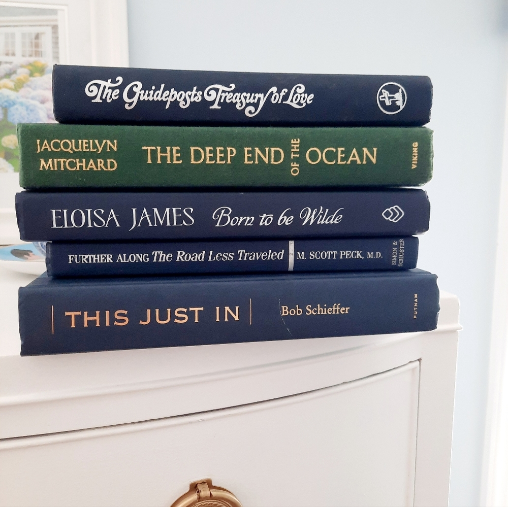Set of 5 blue and green books for staging.